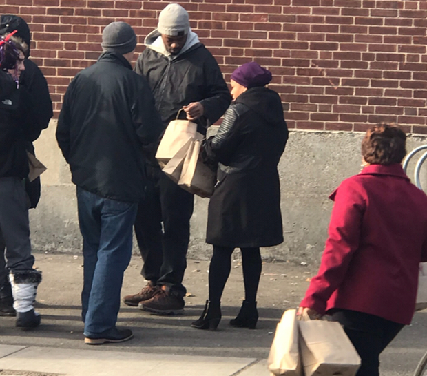 Probation Officer Shelly Dunner hands out Christmas bags.