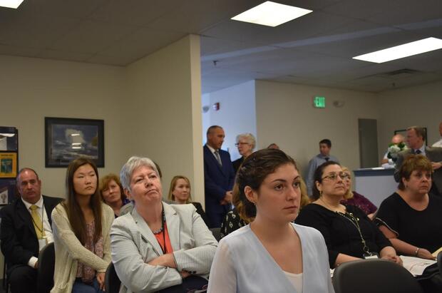 The audience listens intently at the grand opening of the Woburn Community Corrections Center.