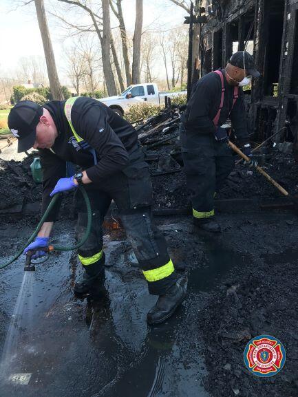 MSP Fire Investigators examining a fire scene.