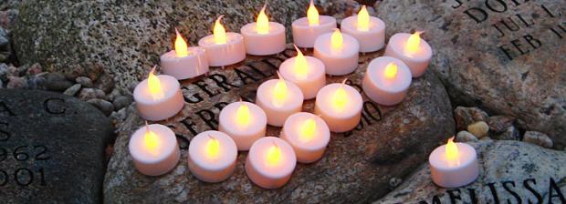 Candles on engraved stone
