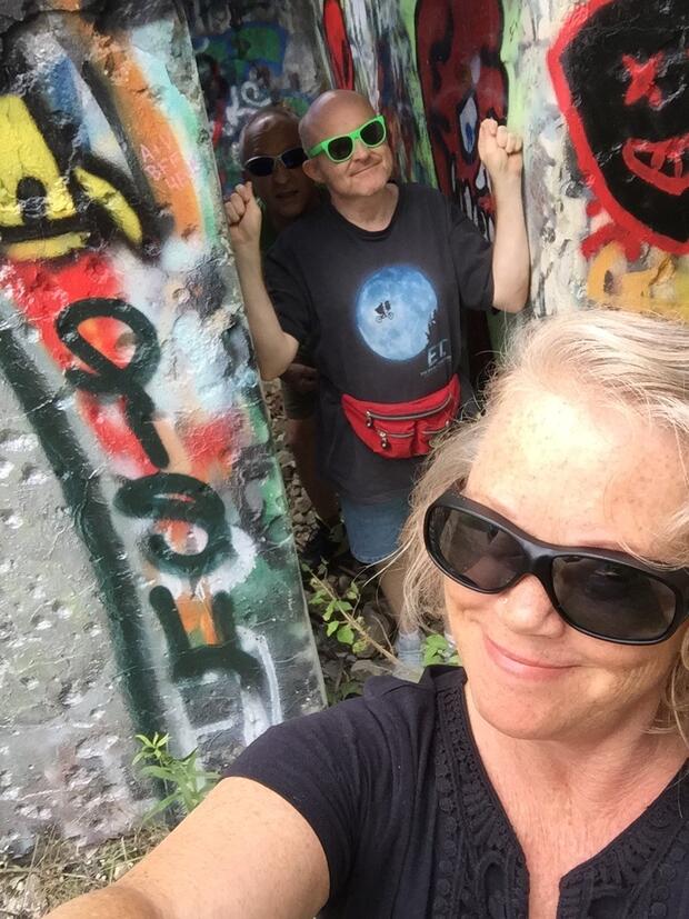 Glenn and Cheryl wear sunglasses while on an adventure outdoors.