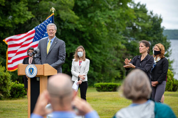 Governor Baker speaking at a podium.