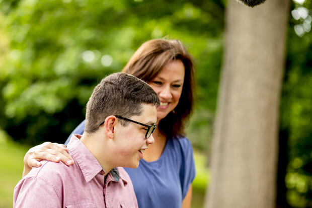 Laura and Charlie Richards walking outdoors at Perkins School for the Blind