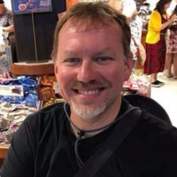 Headshot of Jason Wells, Executive Director of the Deaf-Blind Contact Center