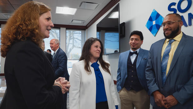 Secretary Acosta and two other people at the Banking apprenticeship event