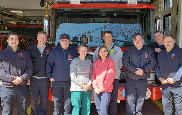 Dr. Kannler and Abby Baker with Everett firefighters after cancer screenings. 