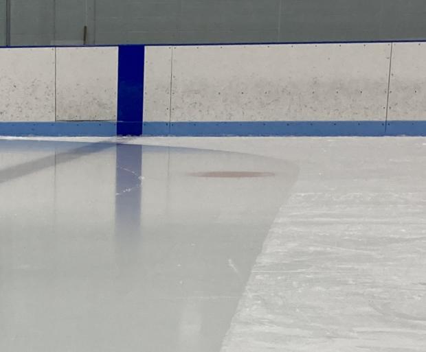 The ice on the left is smooth and reflective while the ice on the right is rough and matte.