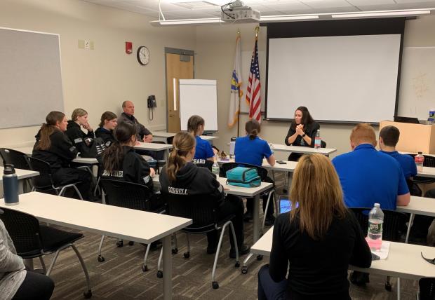 High school students discuss public safety careers with Deputy State Fire Marshal Maribel Fournier