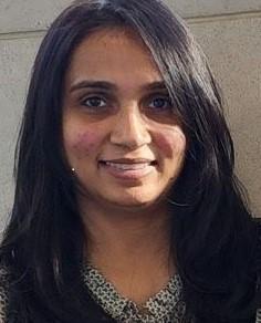Pinal Patel works at Massachusetts State Public Health Laboratory. It is a headshot of Pinal. Pinal has long dark hair and she is smiling at the camera.