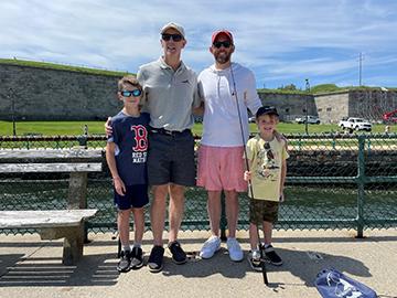 DFG Commissioner Tom O’Shea, center left, and DCR Commissioner Brian Arrigo, center right, were joined by their sons for Reel Fun Fishing Days at Castle Island in South Boston on Saturday