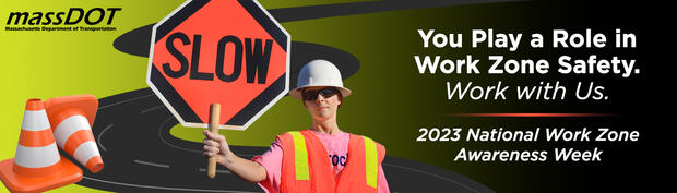 second place billboard design showing road worker holding slow sign in front of squiggly illustrated road and safety cones