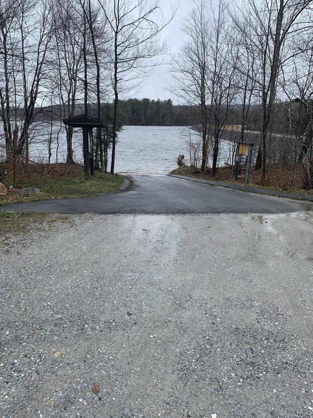 paved boat ramp with long approach terminating at waters edge