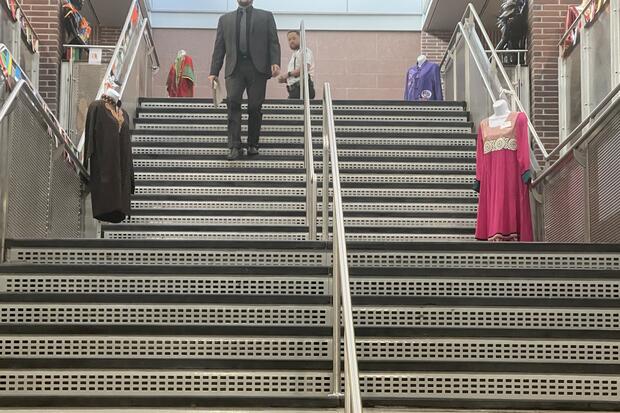 Global outfits line the main stairwell at Fenton Judicial Center.