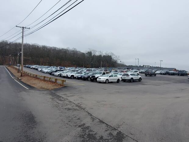 large asphalt parking area across the street from the ramp at Memorial Field