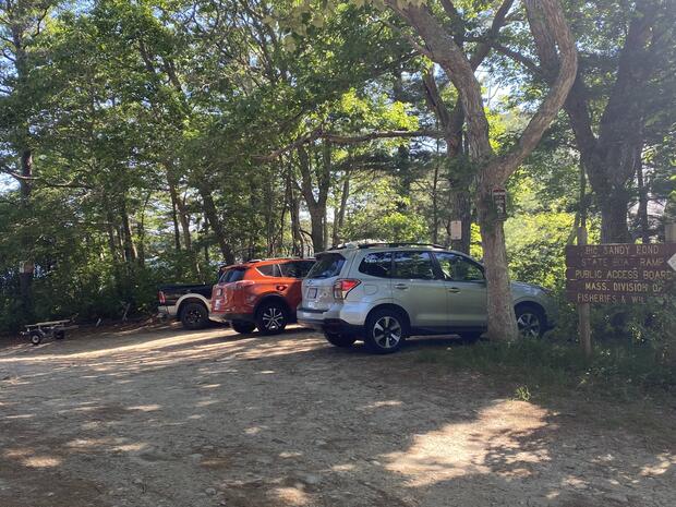 small gravel and sand parking area near launch