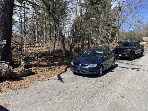 parking for the boat launch at baddacook pond along the road