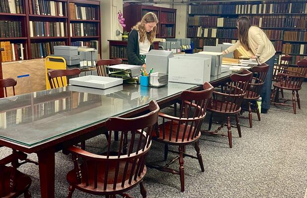 Interns in the State Library's Special Collections Department processing an archival collection