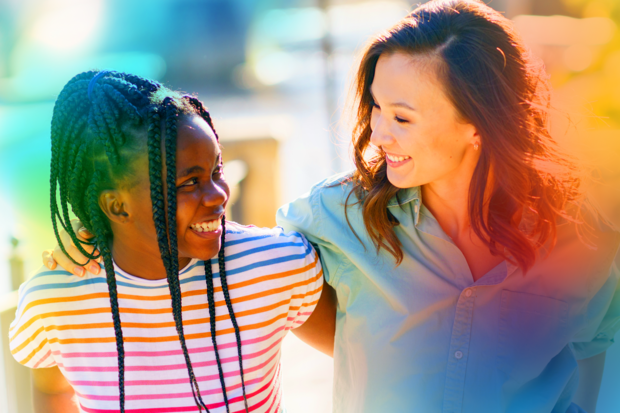 a woman and child smiling at each other