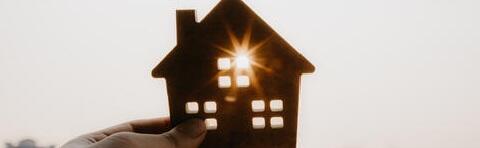 A wooden cutout of a house