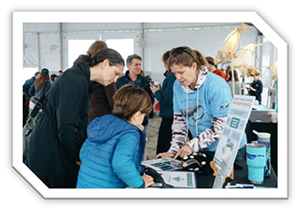 Right Whale day attendant talks to visitors.