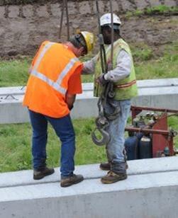 2 guys in safety vests