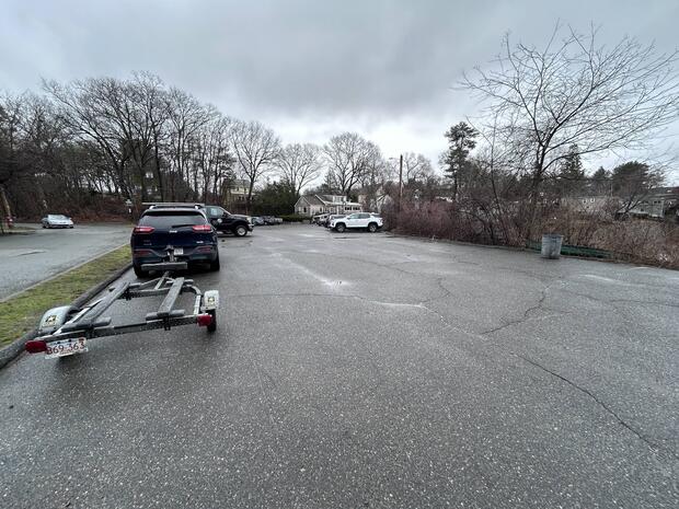 small parking lot near the gravel launch into Dudley Pond