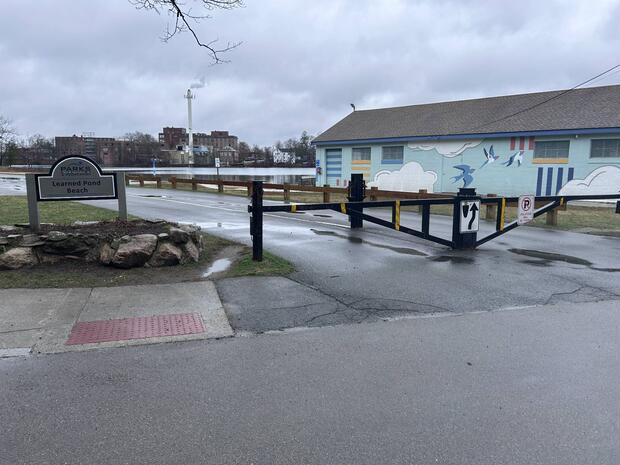 entrance to learned pond beach with gate across road