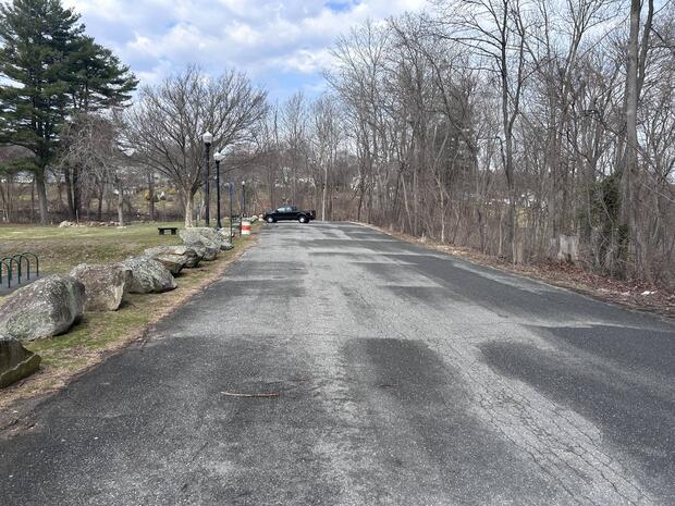 asphalt parking area at Woods Park along ball fields