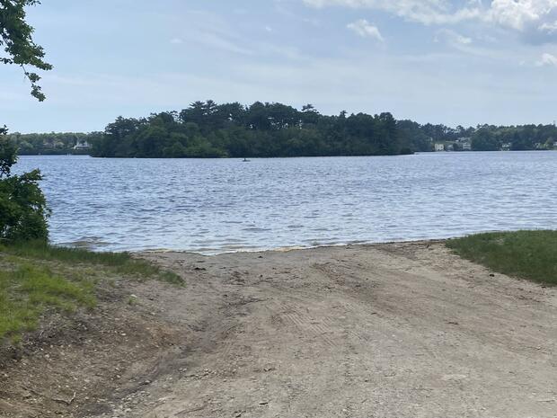 sand ramp leading into the water