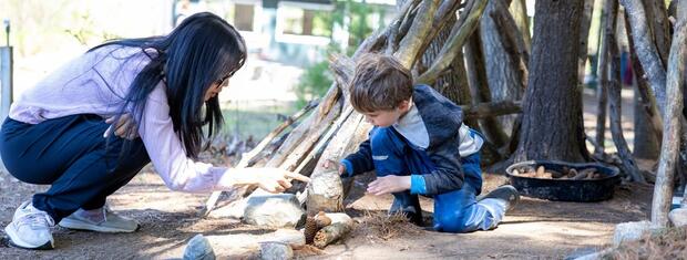 Two children playing in nature.