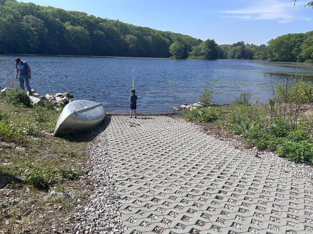 concrete boat ramp terminating at waters edge