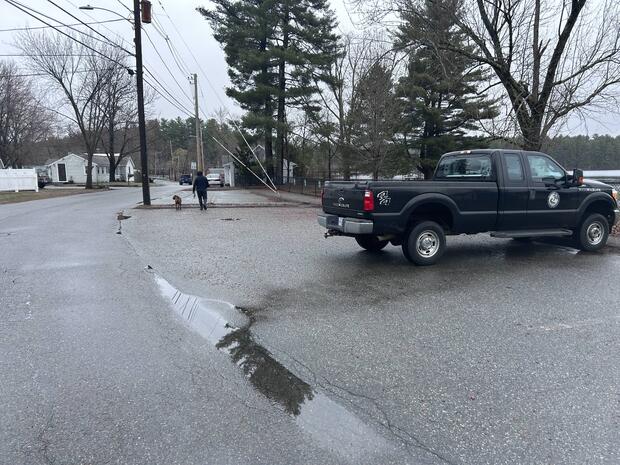 Paved parking area adjacent to town beach at Sandy Pond