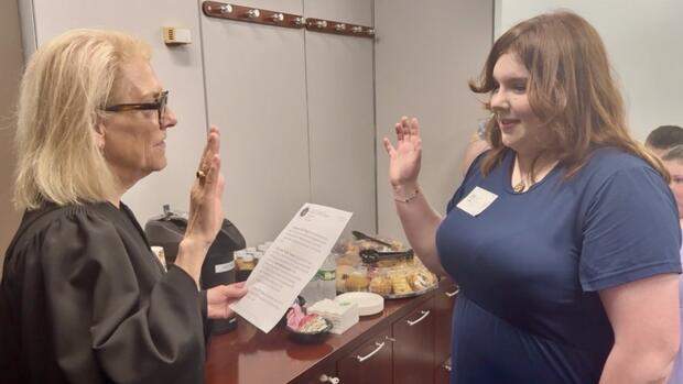 A judge swears in a woman as co-commissioner of MPS for a day.