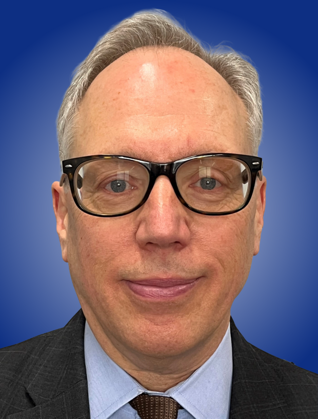 Commissioner Ed Mitnick headshot on MCAD blue background gradient