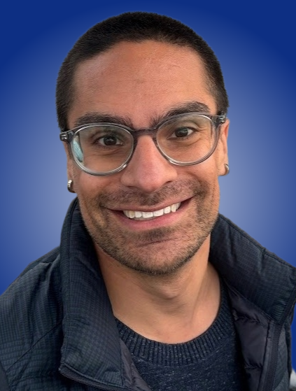 Commissioner Jeremy Scheiner headshot on MCAD blue background gradient