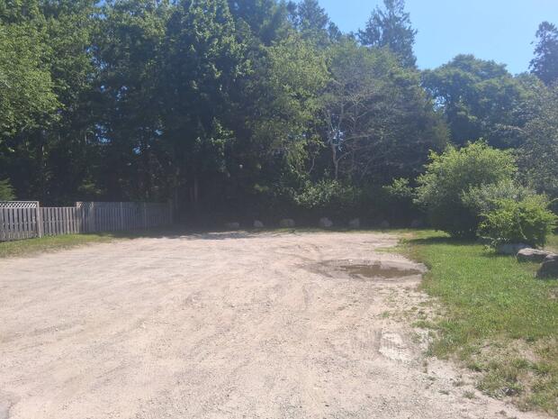 gravel and sand parking area in full sun