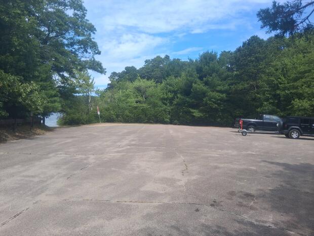 gravel expanse with two cars