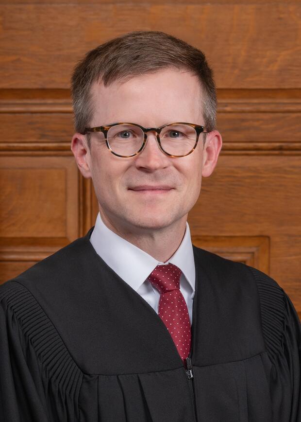 Justice Zachary M. Hillman wearing a judicial robe.