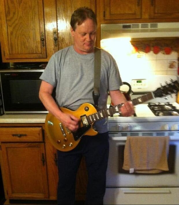 Bill Hewlett playing guitar