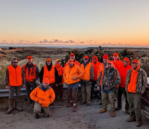 group of hunters wearing blaze orange