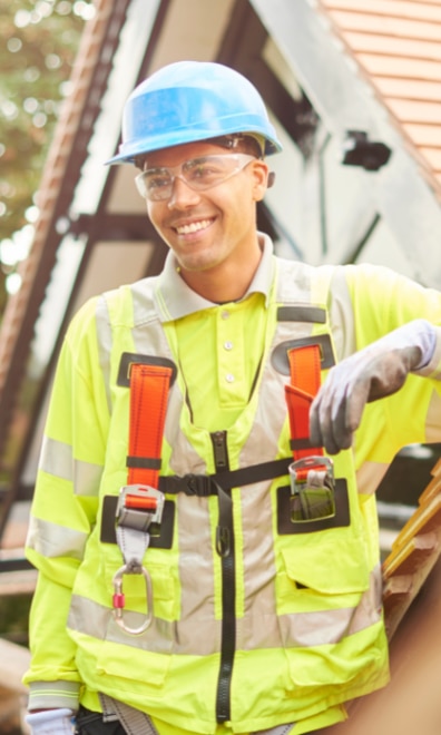 Apprentice wearing a yellow safety vest