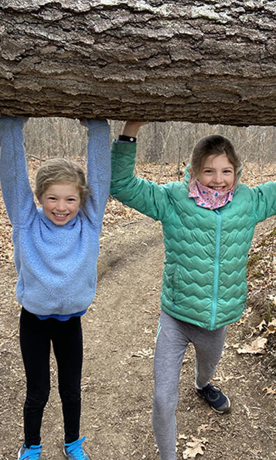 kids holding tree