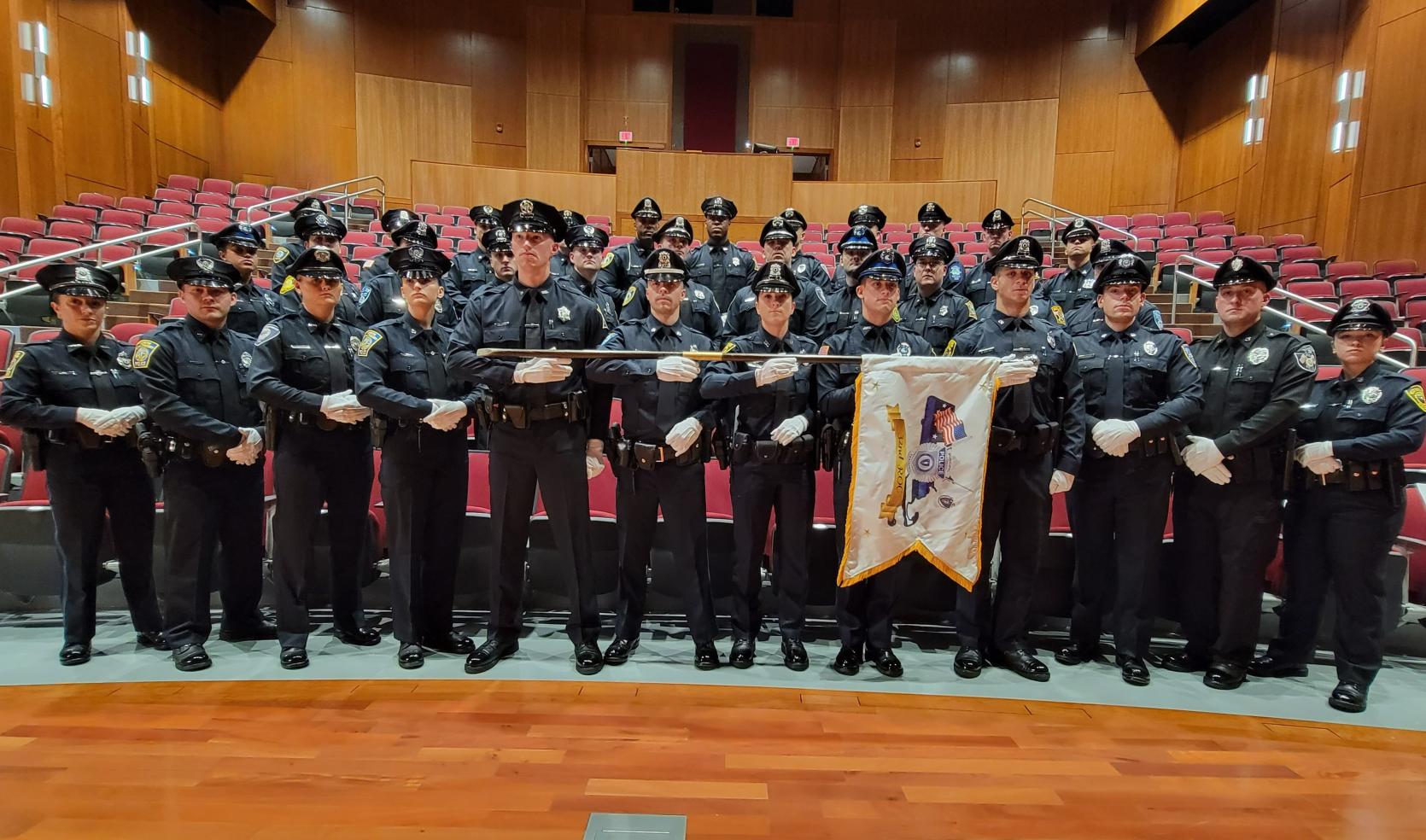 34 Police Officers stand together for a photo for graduation from the MPTC Police Academy